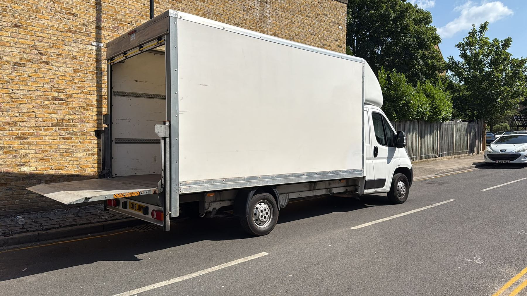 Carry Folk Luton van with tail lift ramp down, ready for loading